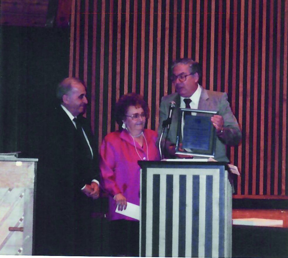 Frank and Charlotte Cohen being presented with an award
